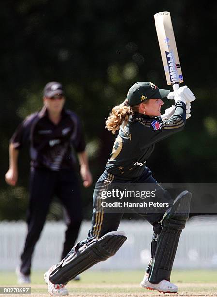 Jodie Purves of Australia drives during the fourth Rose Bowl Series One Day International match between the New Zealand Silver Ferns and Australian...