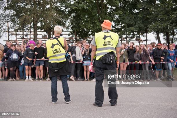 Safety Officers watch the crowd on Day 5 of Roskilde Festival on June 28, 2017 in Roskilde, Denmark.