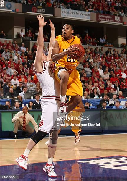 Lawrence Westbrook of the Minnesota Golden Gophers drives for a shot attempt against Kyle Taber of the Indiana Hoosiers during the Big Ten Men's...