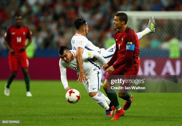 Mauricio Isla of Chaile nd Gary Medel of Chile colide as Cristiano Ronaldo of Portugal gets away during the FIFA Confederations Cup Russia 2017...