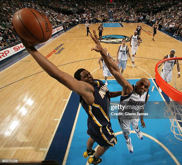Jerry Stackhouse of the Dallas Mavericks attempts to block a dunk against the Indiana Pacers on March 14, 2008 at the American Airlines Center in...