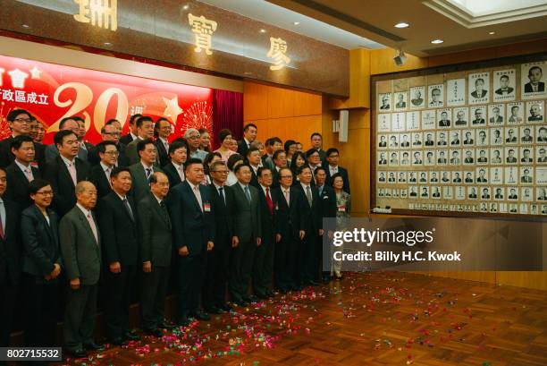 Hong Kong Chiu Chow Chamber of Commerce members celebrate ahead of 20th anniversary of the handover from Britain to China on May 23, 2017 in Hong...