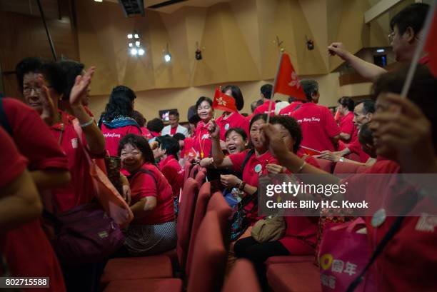 Members of the local chamber of commerce celebrate ahead of 20th anniversary of the handover from Britain to China on May 29, 2017 in Hong Kong, Hong...