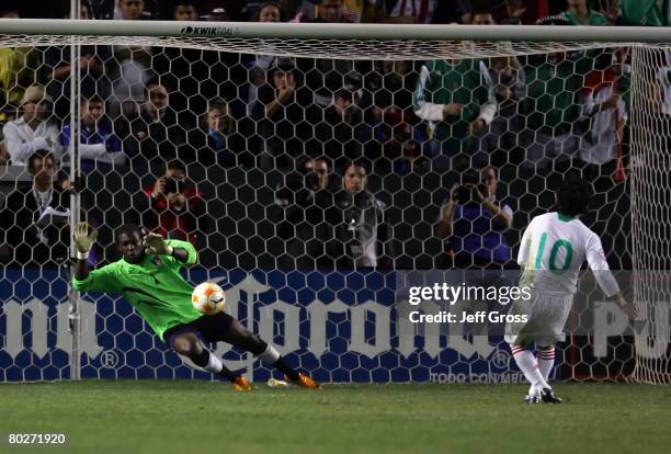 Goalkeeper Johnny Placide of Haiti makes a save on a penalty kick by Cesar Villaluz of Mexico in the second half during the CONCACAF Men's Olympic...