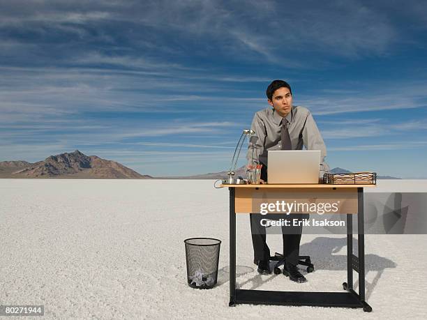 hispanic businessman at desk on salt flats - laptop desert stock pictures, royalty-free photos & images
