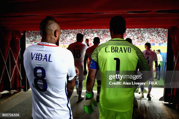 Arturo Vidal of Chile and Claudio Bravo of Chile walk out for the second half during the FIFA Confederations Cup Russia 2017 Semi-Final between...