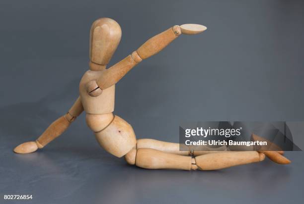 Stay healthy! Symbol photo with model doll on the topic gymnastics.