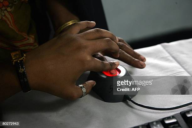 Bangladeshi villager has her fingerprint scanned and saved by an official to an extensive database in Rajashi Division some 200kms north-west of...