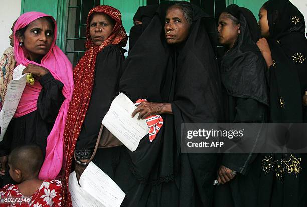 Bangladeshi villagers queue to have their photographs and signatures taken and saved to an extensive database in Rajashi Division some 200kms...