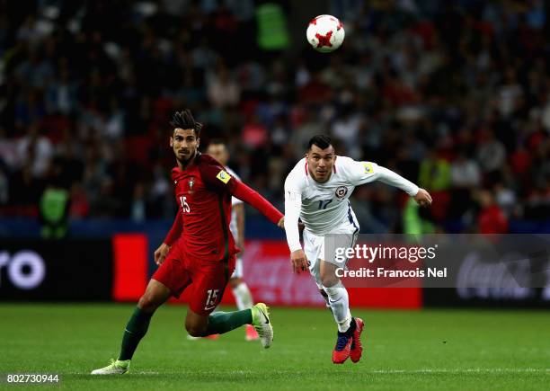 Andre Gomes of Portugal and Gary Medel of Chile battle for possession during the FIFA Confederations Cup Russia 2017 Semi-Final between Portugal and...