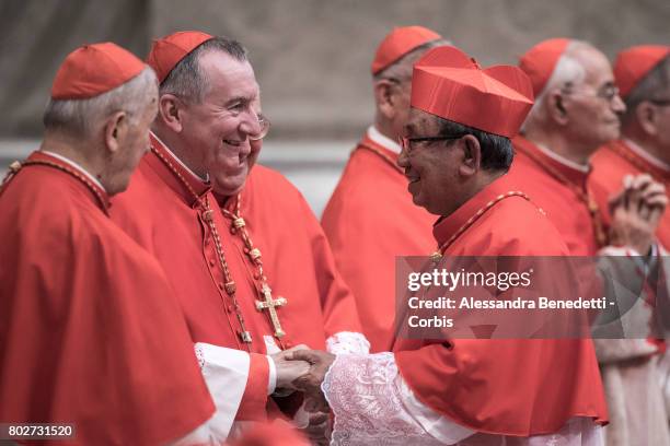 Vatican State Secretary Pietro Parolin greets newly appointed Cardinal Louis-Marie Ling Mangkhanekhoun of Laos, during a Consistory ceremony lead by...