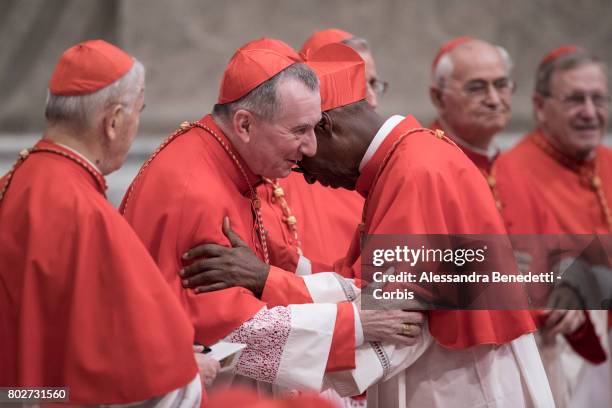 Vatican State Secretary Pietro Parolin greets newly appointed Cardinal Jean Zerbo of Mali during a Consistory ceremony lead by Pope Francis on June...