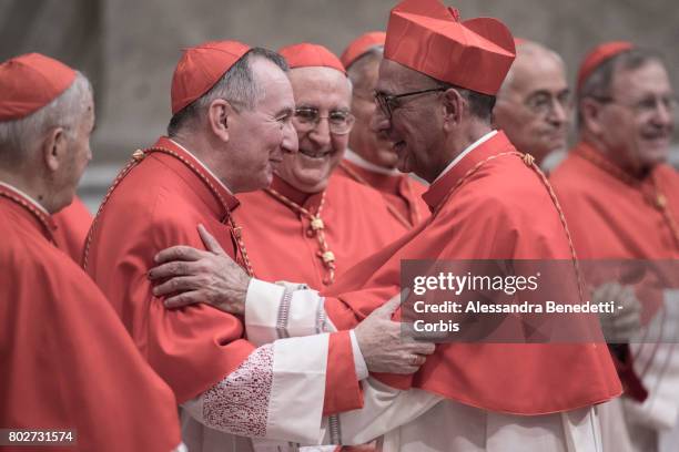 Vatican State Secretary Pietro Parolin greets newly appointed Cardinal Juan Jose Omella of Spain, during a Consistory ceremony lead by Pope Francis...