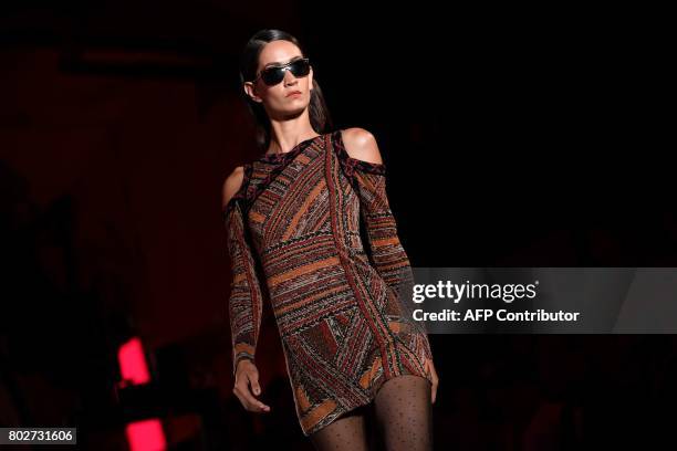 Model presents a creation by Custo Barcelona during the 080 Barcelona Fashion Week, at Sant Pau hospital, in Barcelona on June 28, 2017. / AFP PHOTO...