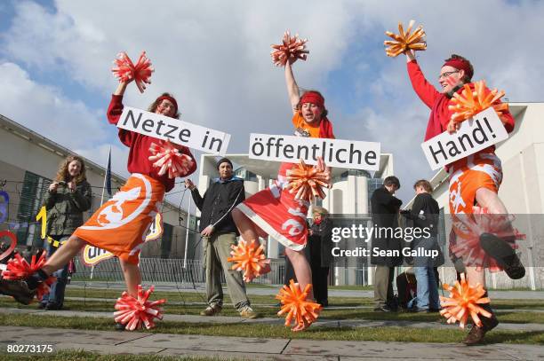 Protesters from the grass-roots group Attac demonstrate with signs that read "Power Grid in the Public Domain!" in front of the Chancellery on March...