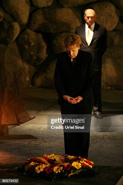 German Chancellor Angela Merkel lays a wreath in memory of the 6 million Jews killed by the Nazis during World War Two as Israeli Prime Minister Ehud...