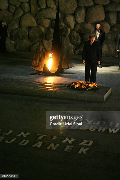 German Chancellor Angela Merkel lays a wreath in memory of the 6 million Jews killed by the Nazis during World War Two as Israeli Prime Minister Ehud...