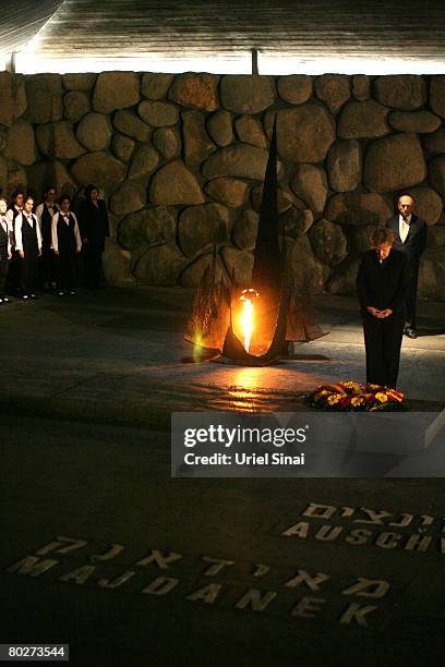 German Chancellor Angela Merkel lays a wreath in memory of the 6 million Jews killed by the Nazis during World War Two as Israeli Prime Minister Ehud...