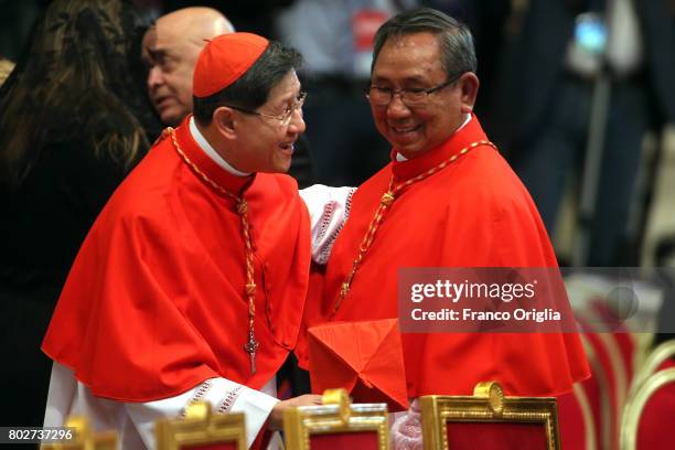 Newly appointed cardinal Louis-Marie Ling Mangkhanekhoun receives congratulations from archbishop of Manila cardinal Luis Antonio Tagle during a...