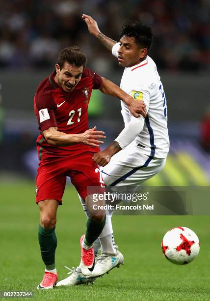 Cedric of Portual attempts to get past Gonzalo Jara of Chile during the FIFA Confederations Cup Russia 2017 Semi-Final between Portugal and Chile at...