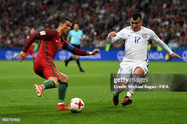 Cristiano Ronaldo of Portugal shoots as Gary Medel of Chile attempts to block during the FIFA Confederations Cup Russia 2017 Semi-Final between...