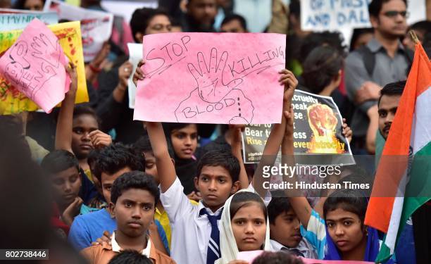School students also join hands to support a campaign 'Not in My Name' in protest against the lynching of Muslim boy, at Town Hall on June 28, 2017...