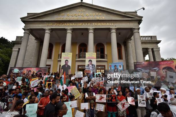 People join hands to support a campaign 'Not in My Name' in protest against the lynching of Muslim boy, at Town Hall on June 28, 2017 in Bengaluru,...