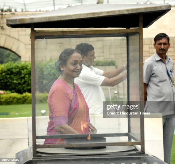 Meira Kumar, UPA candidate for the President of India, paying floral tributes to Father of the Nation Mahatma Gandhi at Rajghat before filing her...