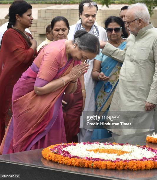 Meira Kumar, UPA candidate for the President of India, paying floral tributes to Father of the Nation Mahatma Gandhi at Rajghat before filing her...