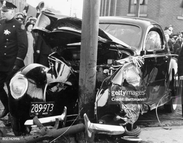 The automobile of Edward J. O'Hare, president of Chicago's Sportsman's Park race track, wrecked against a pole into which it crashed after O'Hare was...