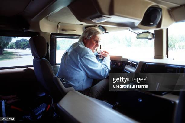 Actor Fess Parker who starred in Disney's "Davy Crockett" series in the 1950's drives around in his Hummer May 25, 2000 in Los Olivos, CA.