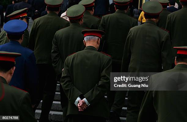 Military delegates walk into the Great Hall of the People for the seventh plenary session of the National People's Congress , or parliament, on March...
