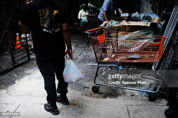 Food is handed out at a street food pantry following the release of a report that says poverty has increased on June 28, 2017 in the Bronx borough of...