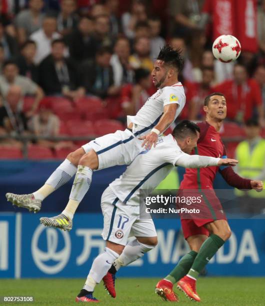 Mauricio Isla , Gary Medel of the Chile national football team and Cristiano Ronaldo of the Portugal national football team vie for the ball during...