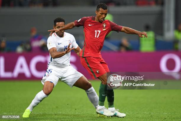 Chile's defender Jean Beausejour vies for the ball against Chile's defender Gary Medel during the 2017 Confederations Cup semi-final football match...