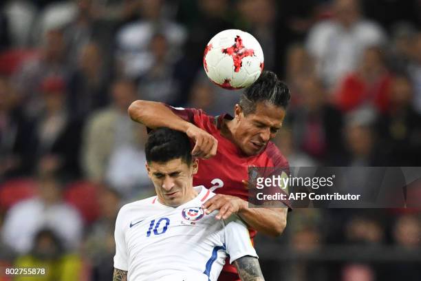 Chile's midfielder Pablo Hernandez fights for the ball against Portugal's defender Bruno Alves during the 2017 Confederations Cup semi-final football...