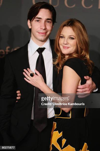 Actor Justin Long and actress Drew Barrymore arrive at the Madonna + Gucci Present A Night to Benefit Raising Malawi at the United Nations on...