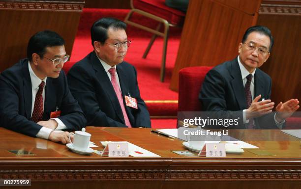 Members of the Politburo Li Keqiang, Li Changchun and China's Premier Wen Jiabao attend the seventh plenary session of the National People's Congress...