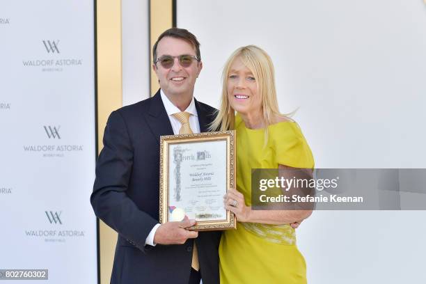 Beny Alagem and Lili Bosse speak onstage during Waldorf Astoria Beverly Hills Grand Opening Celebration on June 28, 2017 in Beverly Hills, California.