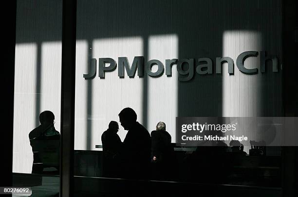 People stand inside the offices of JP Morgan Chase on March 17, 2008 in New York City. JP Morgan Chase bought Bear, Stearns & Co, for $2 a share,...