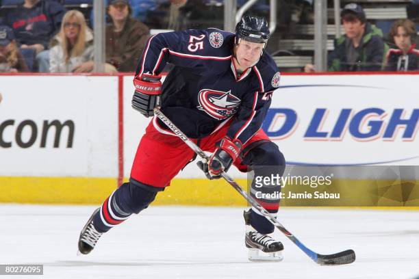 Jason Chimera of the Columbus Blue Jackets skates up ice with the puck against the Chicago Blackhawks on March 14, 2008 at Nationwide Arena in...