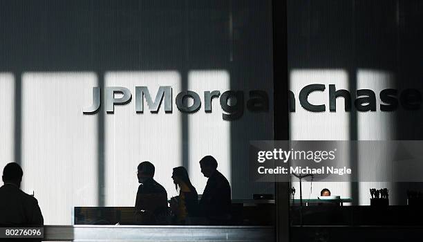 People stand inside the offices of JP Morgan Chase on March 17, 2008 in New York City. JP Morgan Chase bought Bear, Stearns & Co, for $2 a share,...