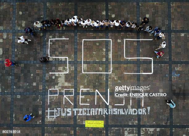 Picture taken with a drone showing journalists demonstrating in demand of justice for slain Mexican journalist Salvador Adame Pardo and other...