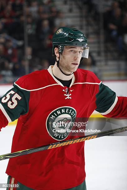 Nick Schultz of the Minnesota Wild skates toward the bench during a break in the action against the New Jersey Devils during the game at Xcel Energy...