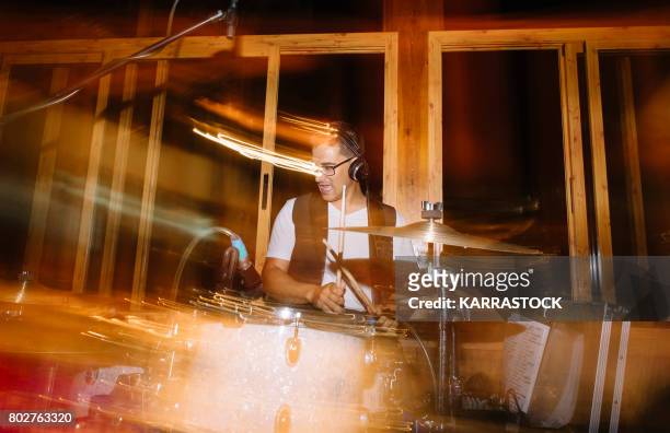 Musician playing drums at a concert