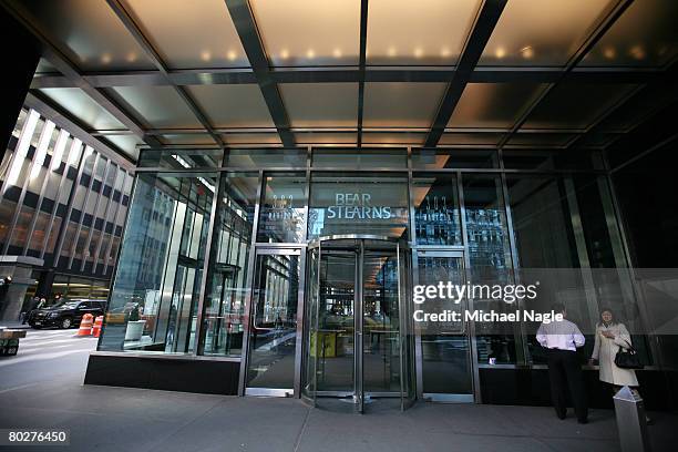 People stand outside the offices of global investment bank, securities trading and brokerage firm Bear, Stearns & Co. On Madison Ave on March 17,...