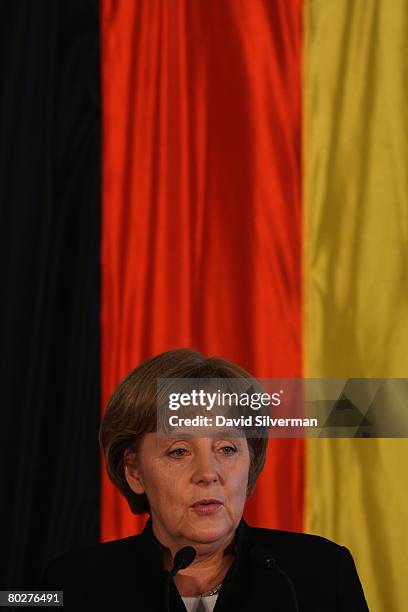 Visiting German Chancellor Angela Merkel addresses a joint press conference with Israeli Prime Minister Ehud Olmert March 17, 2008 at Olmert's office...