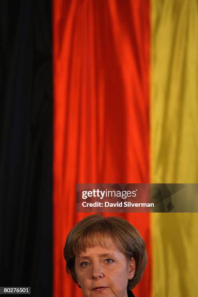 Visiting German Chancellor Angela Merkel addresses a joint press conference with Israeli Prime Minister Ehud Olmert March 17, 2008 at Olmert's office...