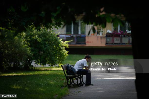 Man is seen alone on a bench in the Poeples Park Vincent Vitos in Bydgoszcz, Poland on 27 June, 2017.