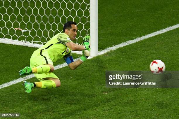 Claudio Bravo of Chile saves Portugal's third penalty during the penalty shoot out during the FIFA Confederations Cup Russia 2017 Semi-Final between...